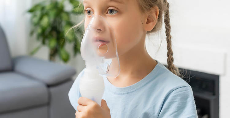little girl using nebulizer for pediatric asthma
